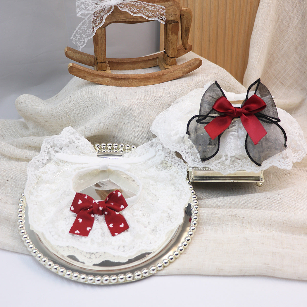 Burgundy heart-print and black bow cat neckwear styles displayed together