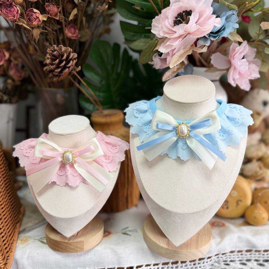 Light Pink and Light Blue decorative pet neckwear displayed on stands