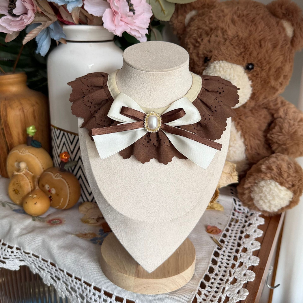 Brown decorative pet neckwear with layered scalloped ruffles and a ribbon bow