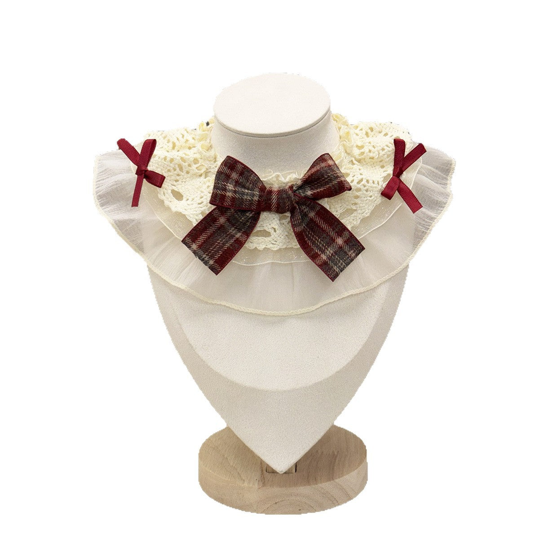 Ruffled pet neckwear with a burgundy-and-gray plaid bow on a white background