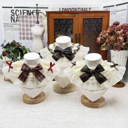 Three ruffled pet neckwear styles with plaid center bows displayed together