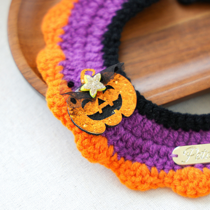 Close-up of the glitter pumpkin accent and orange scalloped edge on Pumpkin Ghost cat neckwear