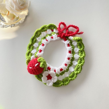 Strawberry pet neckwear with scalloped green edging and flower accent