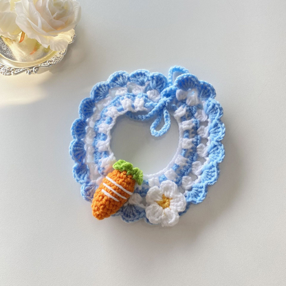 Carrot pet neckwear with blue scalloped edging and flower accent
