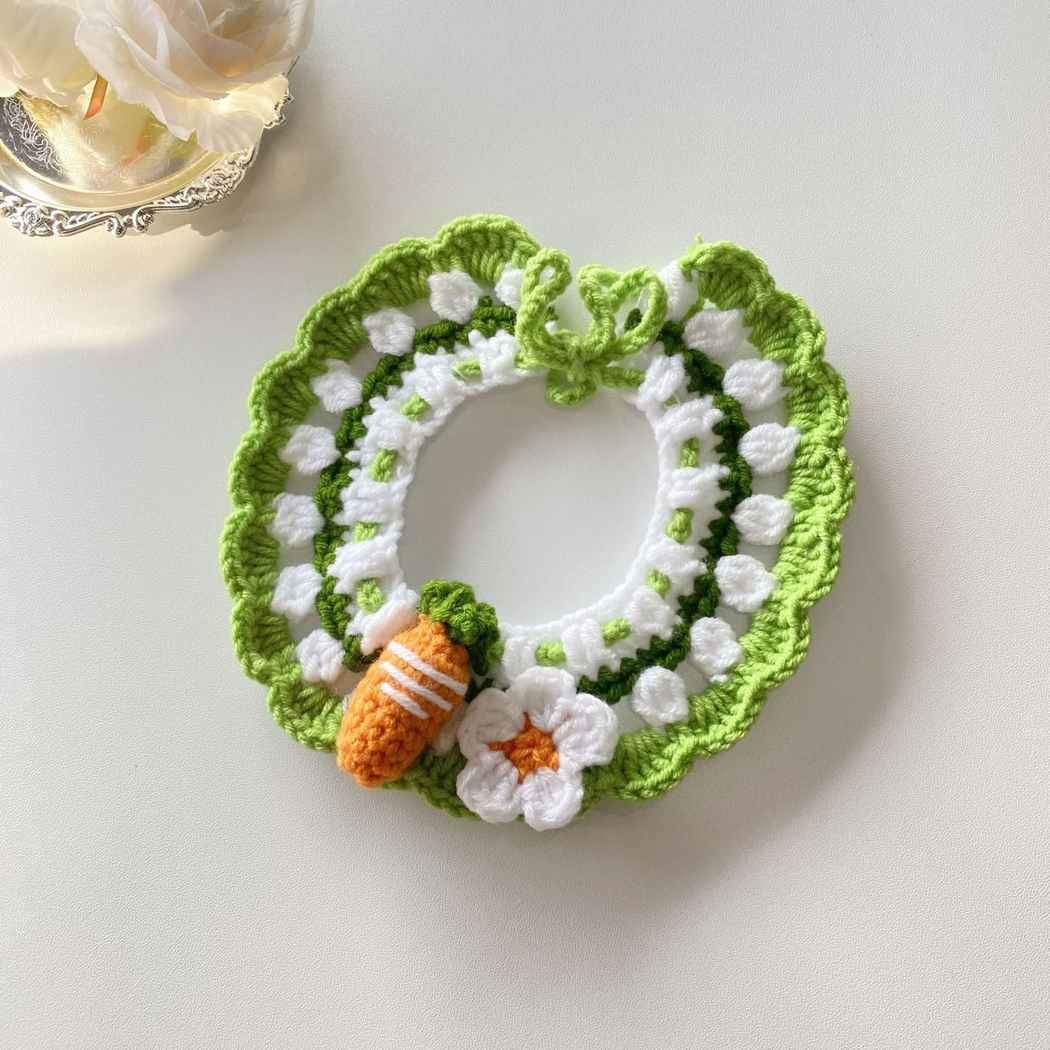 Green pet neckwear with scalloped edging, carrot motif and flower accent