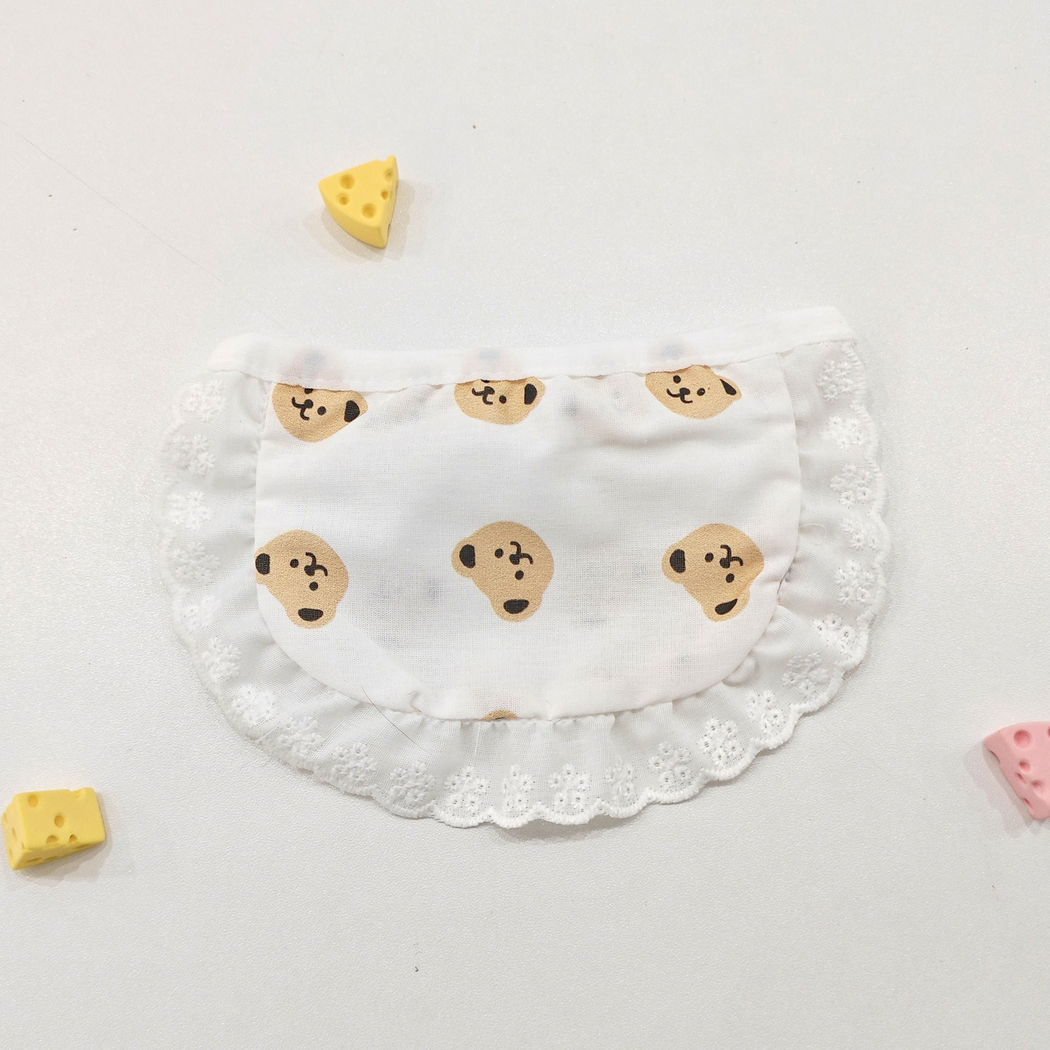 Bear style pet neckwear with repeating tan faces and white ruffle edging