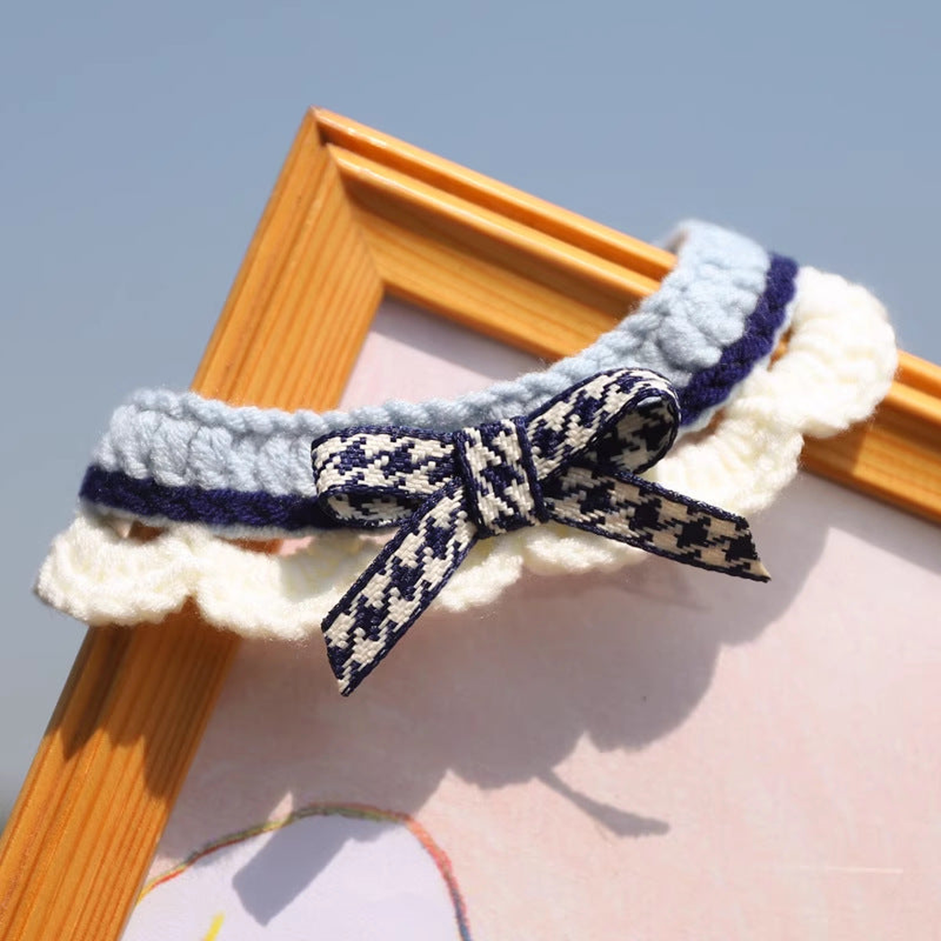 Blue pet neckwear with patterned bow, navy trim and ruffled ivory edge