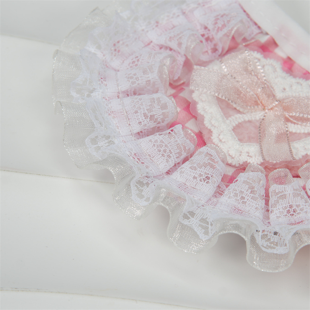 Close-up of layered translucent lace-look ruffles on pink gingham pet neckwear