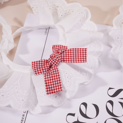 Close-up of the Red gingham bow and scalloped eyelet-style ruffle