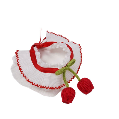 Red-trimmed pleated pet neckwear with green bow and dangling tulip-shaped ornaments