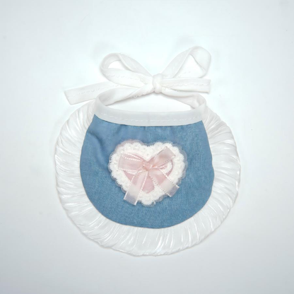 White pet neckwear with blue bib panel, ruffled trim and heart bow decoration