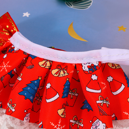 Close-up of the white-edged neck opening and pleated holiday-print panel