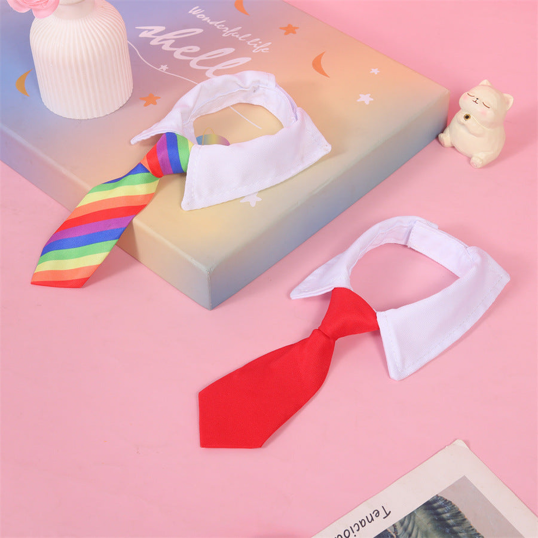 Rainbow and red tie-style pet neckwear on a pink background
