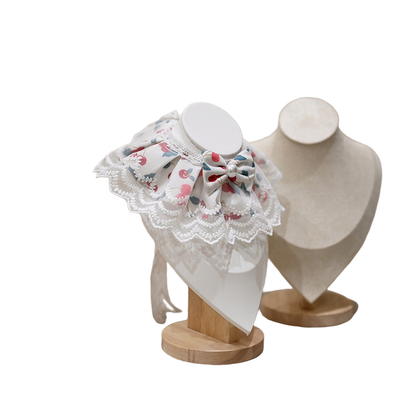 Cherry pet neckwear showing the bow and layered bib from an alternate angle