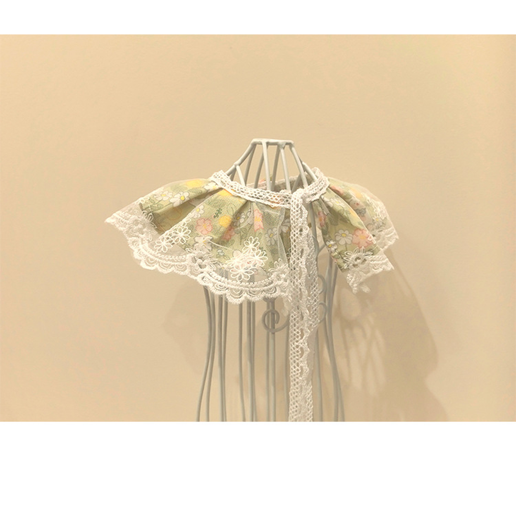 Green floral Pet Neckwear with scalloped lace-look edging and long back ties, rear view