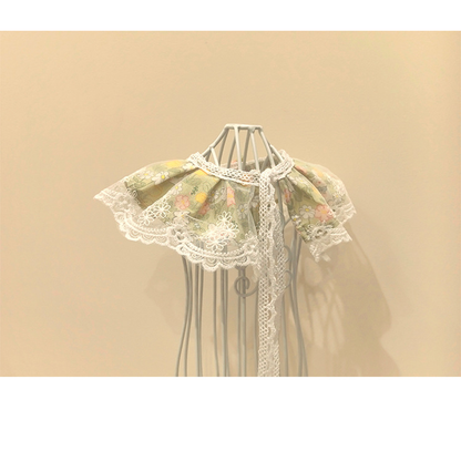Green floral Pet Neckwear with scalloped lace-look edging and long back ties, rear view