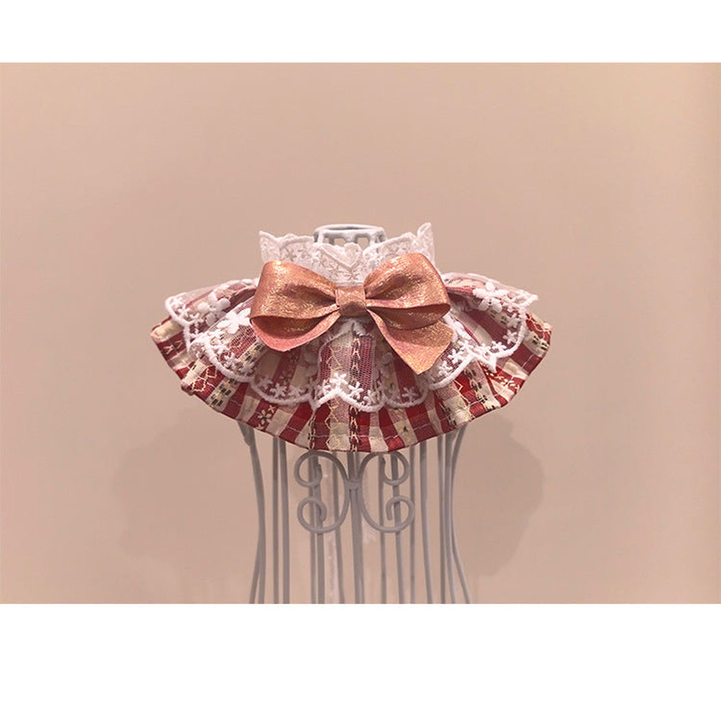 Red plaid pet neckwear with white lace-look ruffles and a metallic pink bow, front view