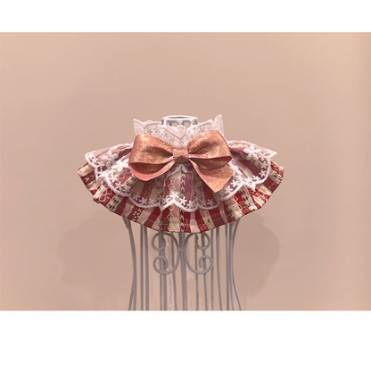 Red plaid pet neckwear with white lace-look ruffles and a metallic pink bow, front view