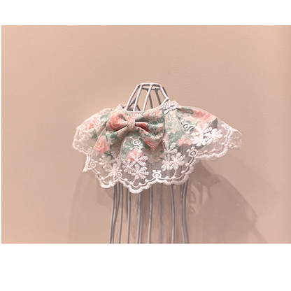 Floral pet neckwear with centered bow and embroidered lace-look edge, opposite angled view