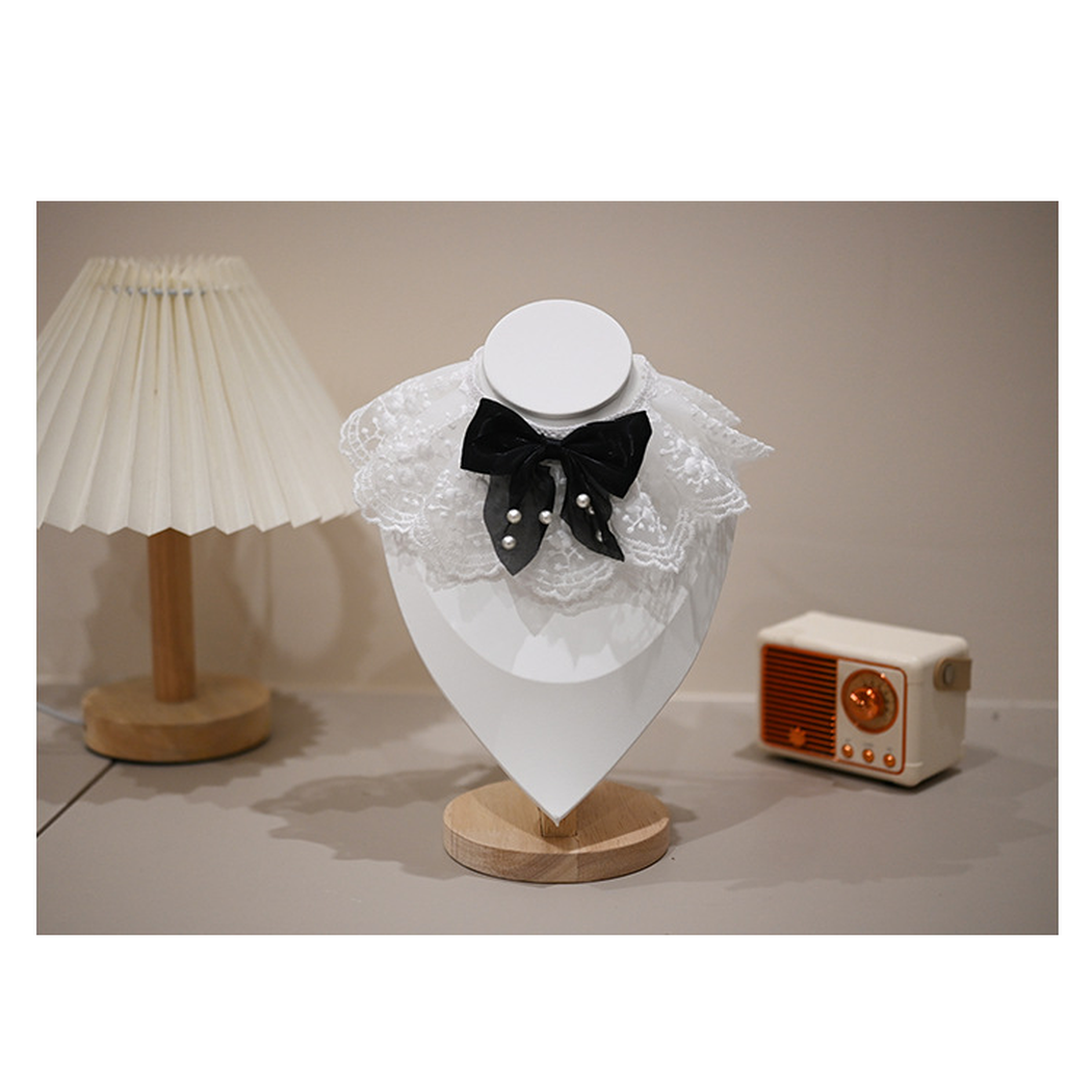 Multicolor pet neckwear with a white lace-look ruff and black bow, front view
