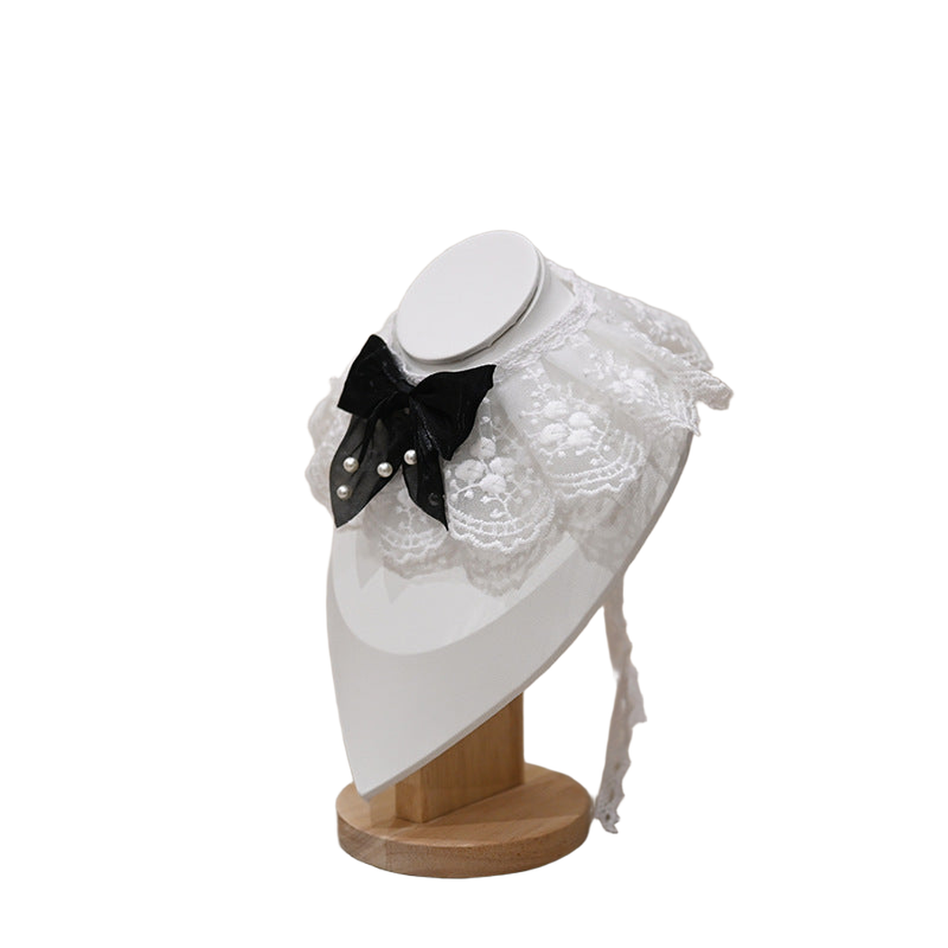 Multicolor pet neckwear with a white lace-look ruff and black bow, left angled view
