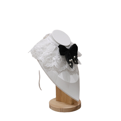 Multicolor pet neckwear with a white lace-look ruff and black bow, right angled view
