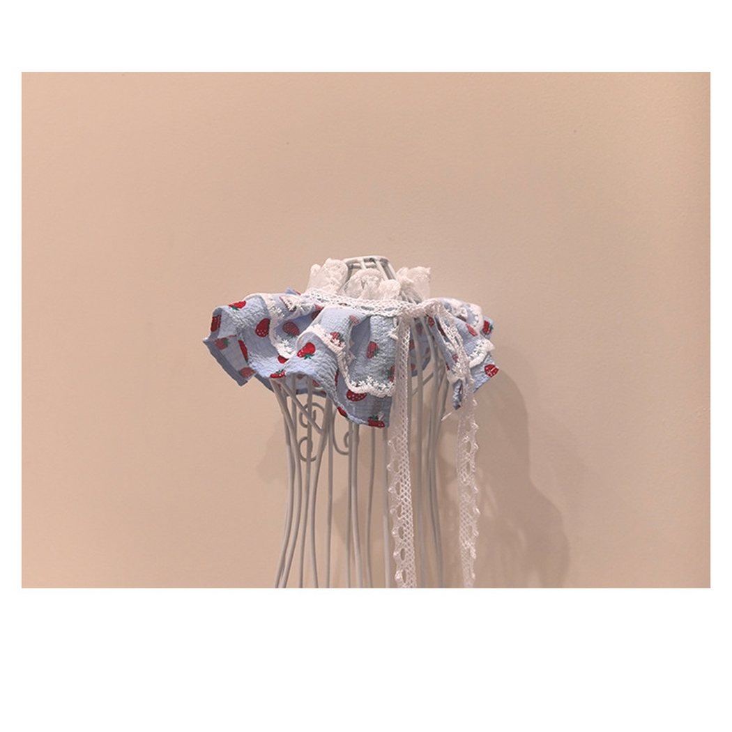 Back detail of strawberry pet neckwear with lace-look tie straps