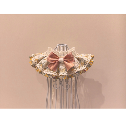 Floral pet neckwear with layered ruffles and rose-pink bow, front overview