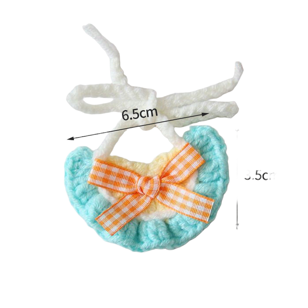 Turquoise pet neckwear with orange gingham bow and tie straps, measured flat