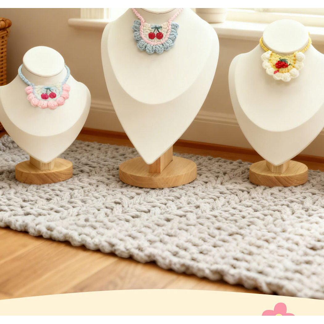 Multiple pet neckwear styles displayed together on three stands