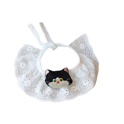 Black cat-face pet neckwear with a white ruffled eyelet-look bib, front view