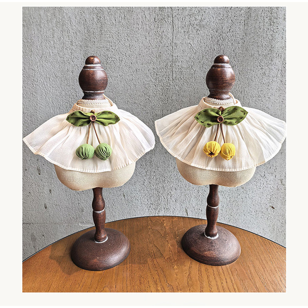 Green Cherry and Yellow Cherry pet neckwear displayed together on stands