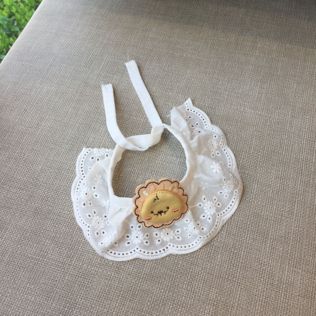 Yellow Lion pet neckwear with white floral eyelet ruffle