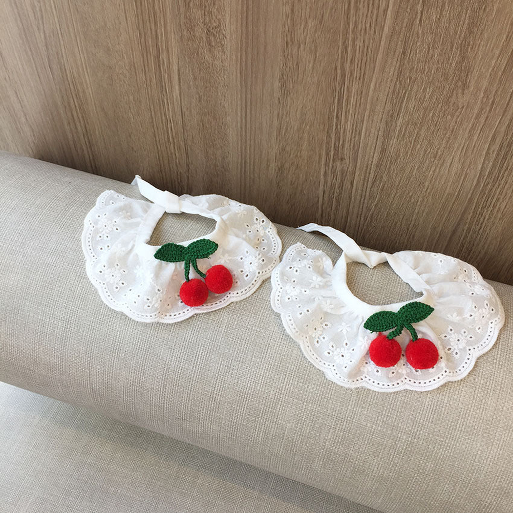 Two sizes of white cherry-accent pet neckwear displayed side by side