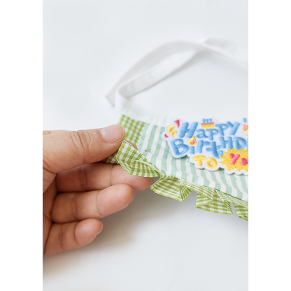 Close-up of the pleated green gingham ruffle edge