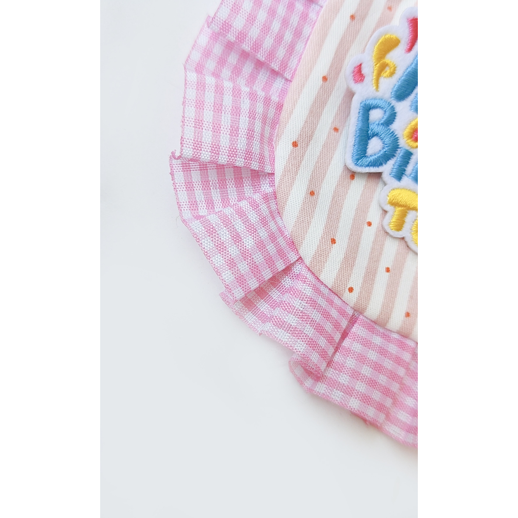Close-up of the pink gingham ruffle and striped center panel