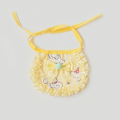 Yellow ruffled pet neckwear with bow and playful dog motif