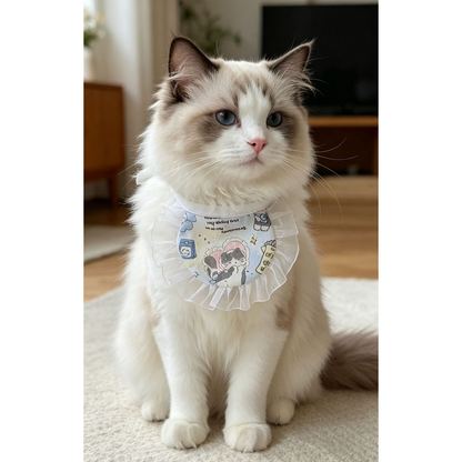 Cat wearing light blue cartoon cat-print pet neckwear with a white ruffled border
