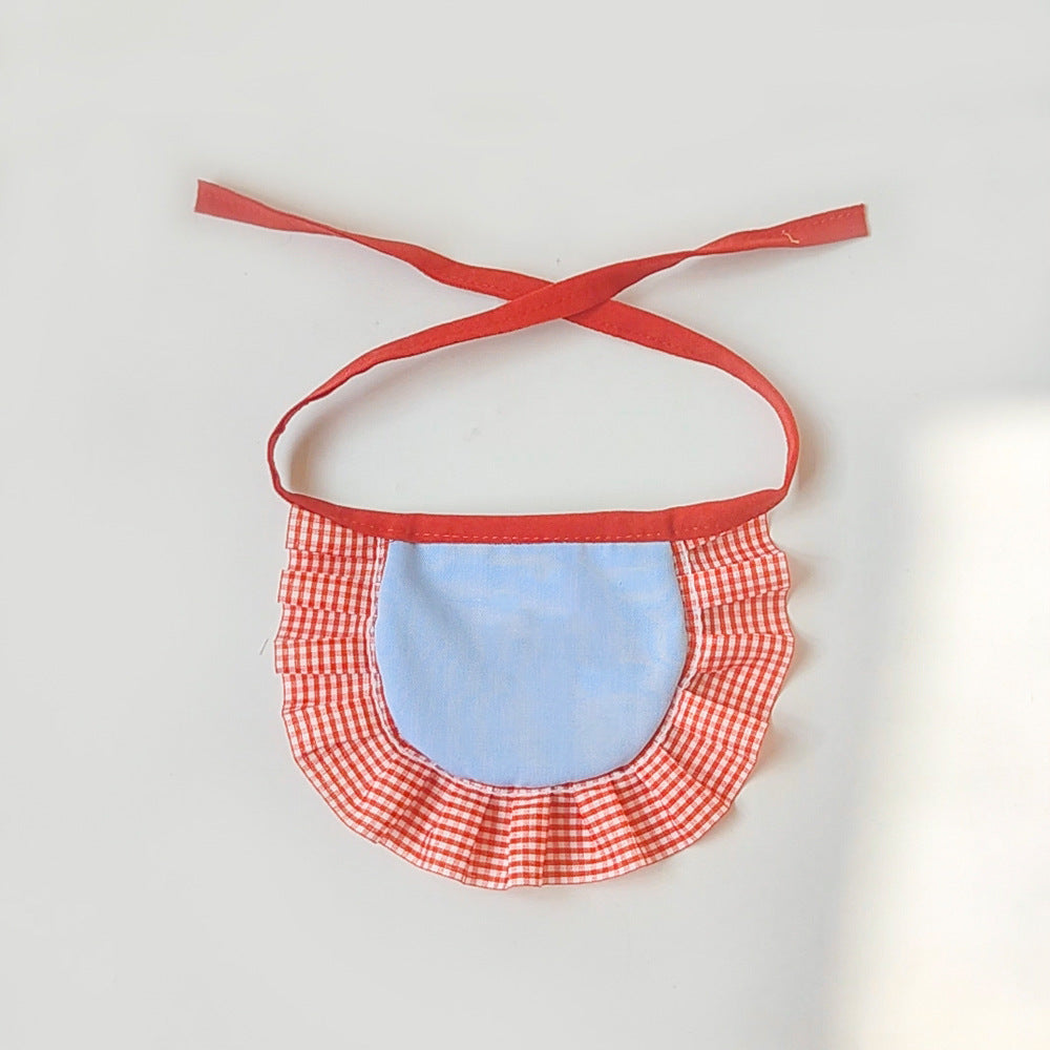 Back view of pet neckwear with blue center panel and gingham ruffle