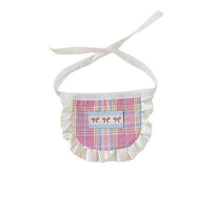 Pink plaid pet neckwear with white ruffled trim and bow motifs