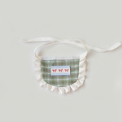Green plaid pet neckwear with white ruffled trim and bow motifs