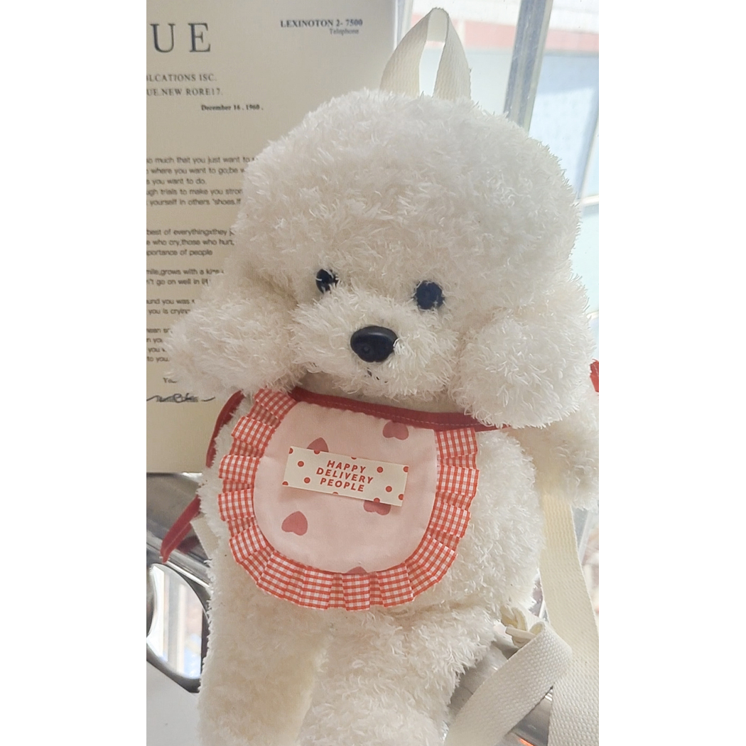 Red Gingham pet neckwear displayed on a plush dog