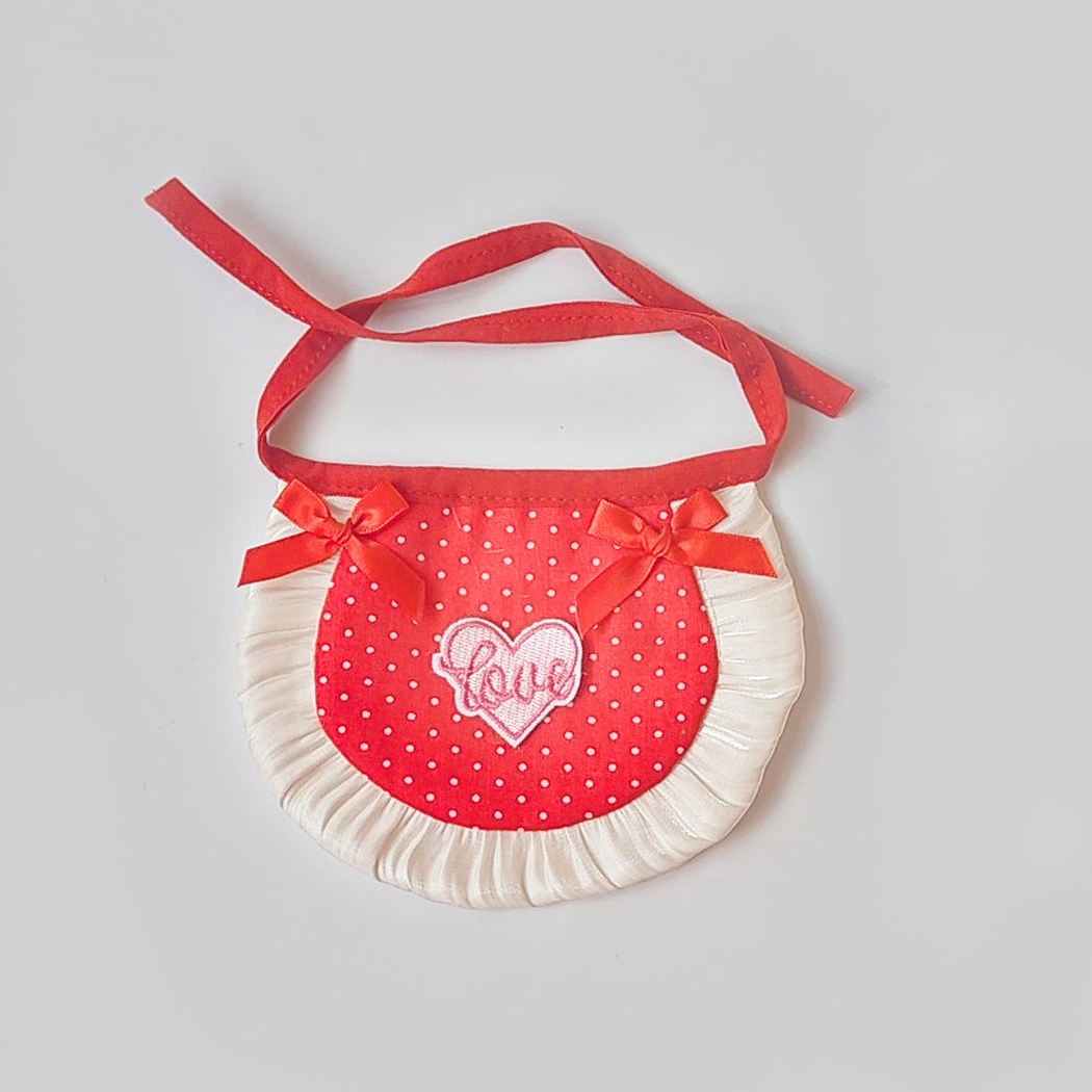 Red polka-dot pet neckwear with red bows, heart patch and ruffled trim