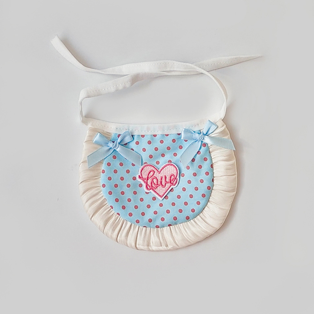 Light blue polka-dot pet neckwear with blue bows, heart patch and ruffled trim
