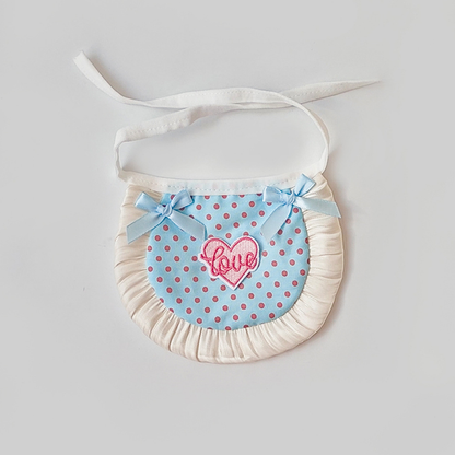 Light blue polka-dot pet neckwear with blue bows, heart patch and ruffled trim