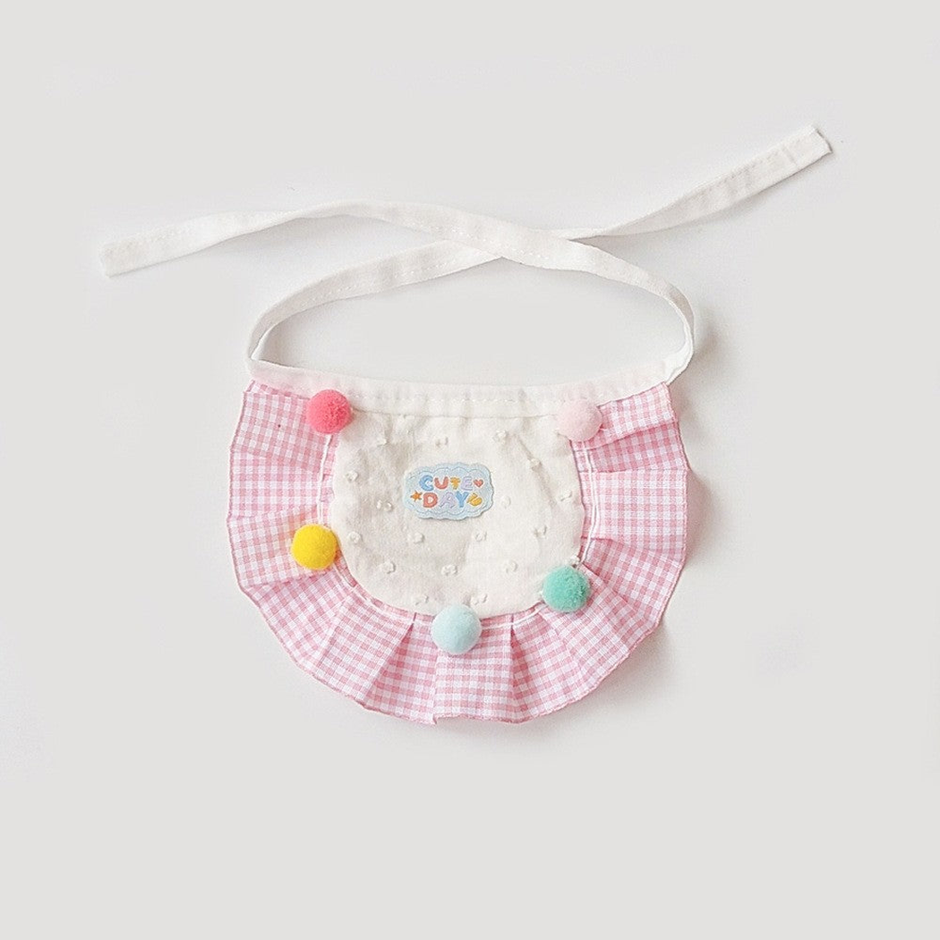 Pink gingham pet neckwear with ruffled border and colorful pom-poms