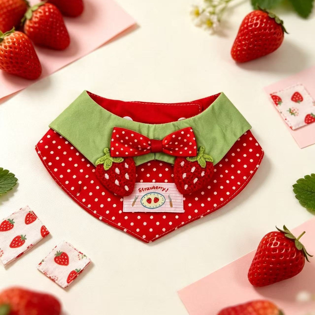 Red strawberry pet neckwear with polka-dot bow and green upper panel