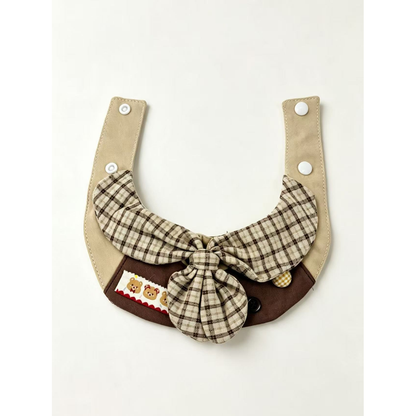 Brown and beige plaid pet neckwear with a large center bow and teddy bear trim, open view