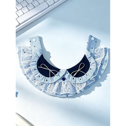 Blue striped pet neckwear opened flat in a portrait view with snap straps and layered ruffles visible