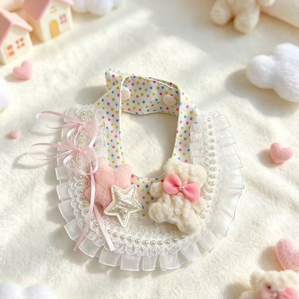 Decorative pet neckwear fastened in a soft pastel flat-lay setting